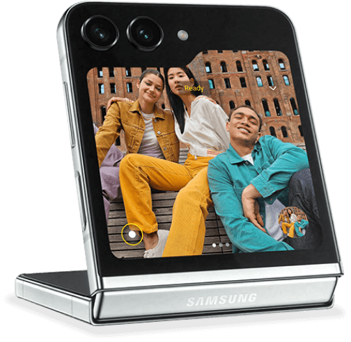 A Galaxy Z Flip5 device open in flex mode showing a group selfie on the cover screen